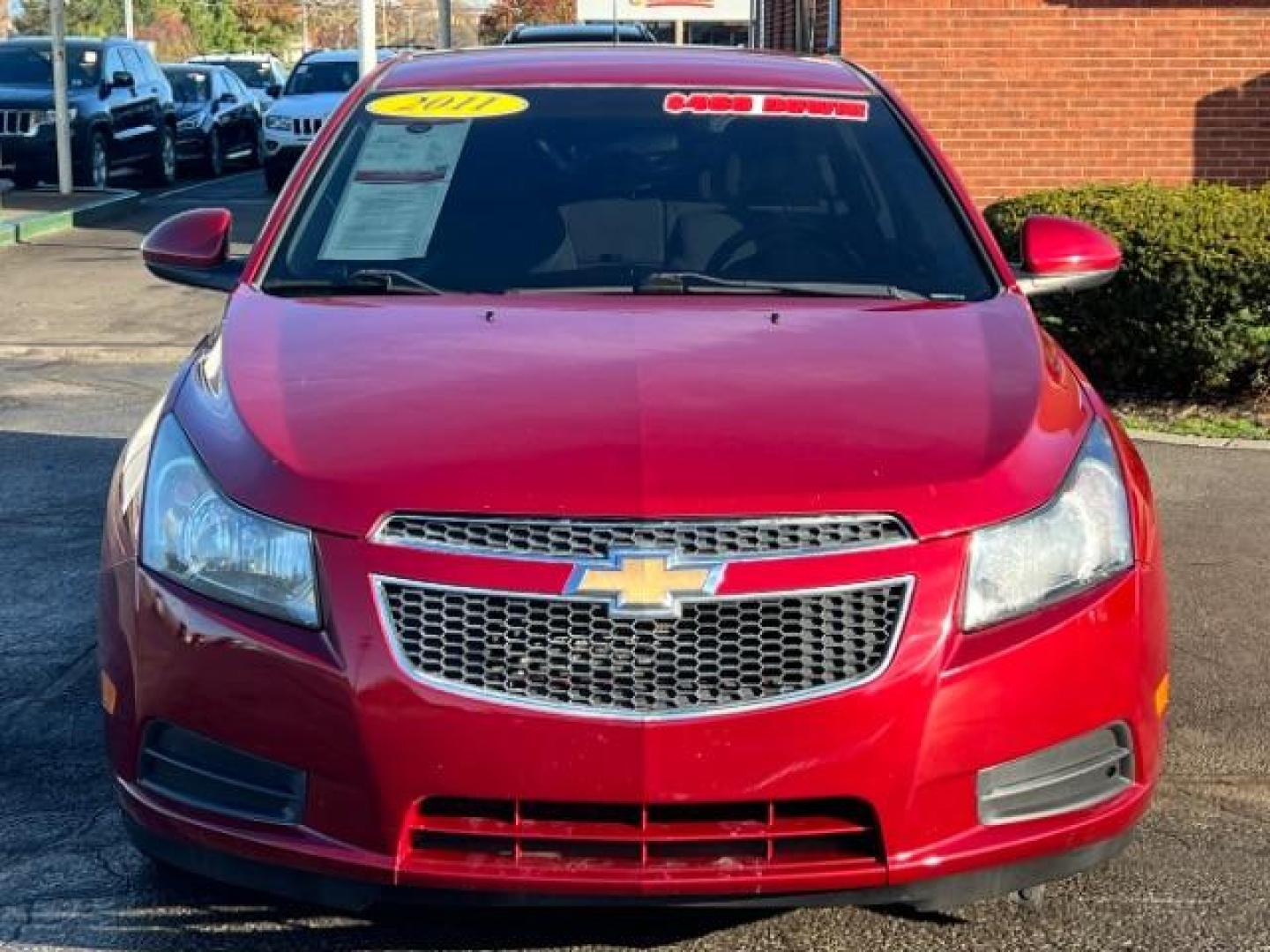 2011 Crystal Red Metallic Chevrolet Cruze 1LT (1G1PF5S93B7) with an 1.4L L4 DOHC 16V TURBO engine, 6-Speed Automatic transmission, located at 1865 W 2nd St., Xenia, OH, 45385, (937) 372-7777, 39.681259, -83.961945 - Photo#1