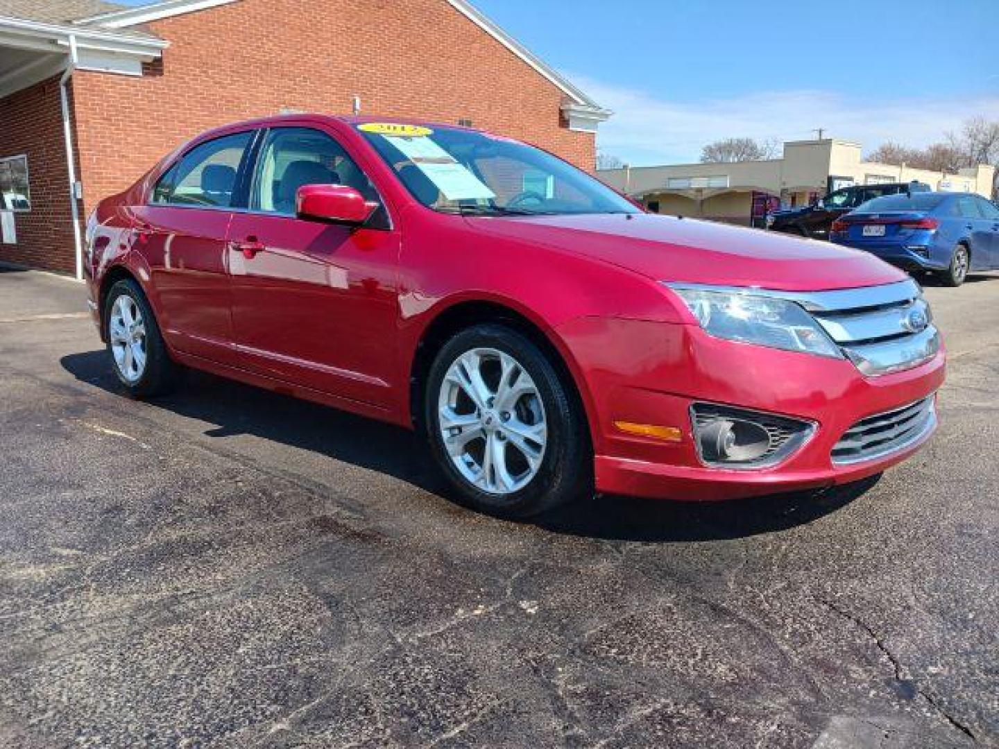 2012 Red Candy Metallic Ford Fusion SE (3FAHP0HA2CR) with an 2.5L L4 DOHC 16V engine, located at 1865 W 2nd St., Xenia, OH, 45385, (937) 372-7777, 39.681259, -83.961945 - Photo#0