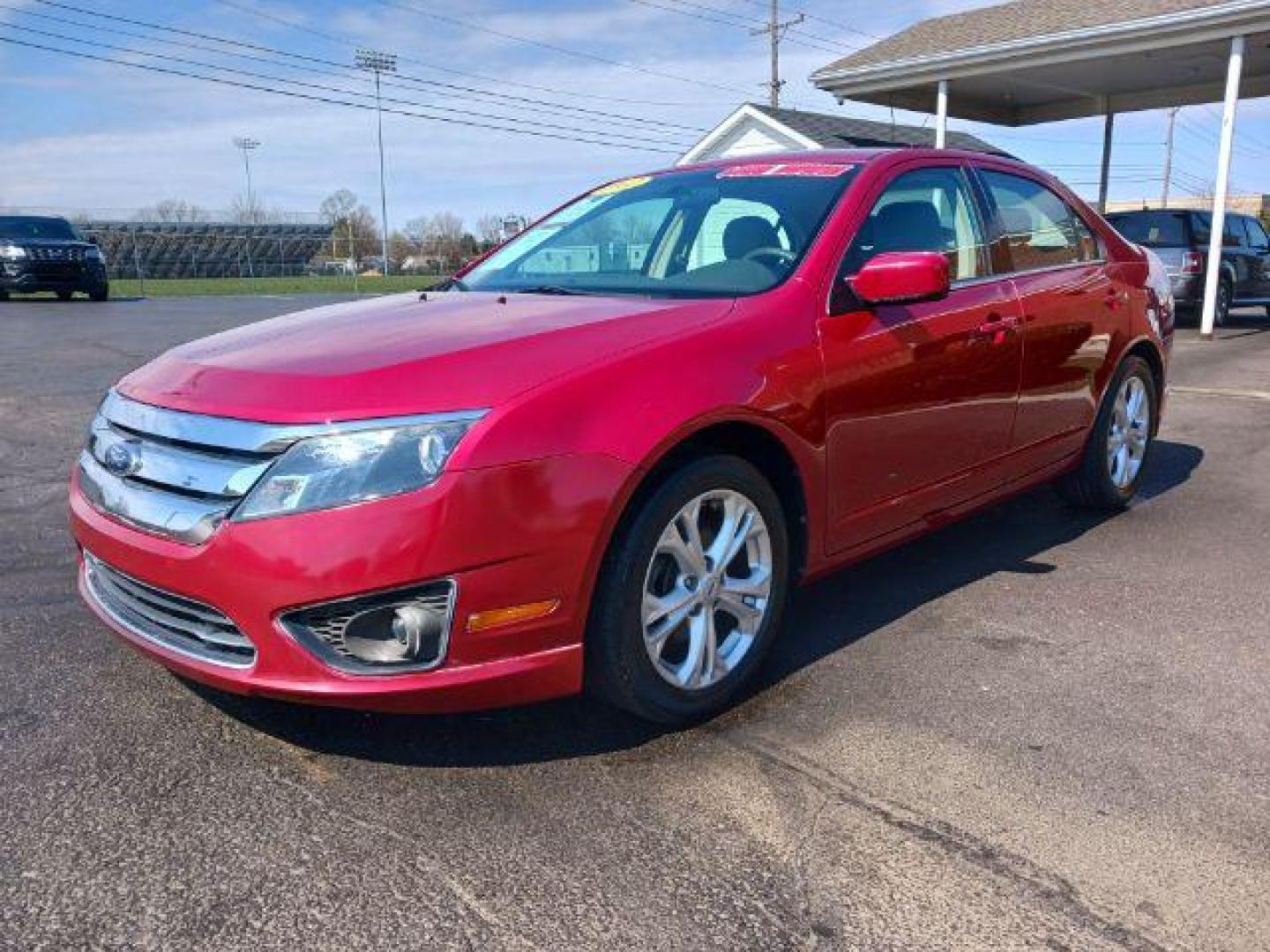 2012 Red Candy Metallic Ford Fusion SE (3FAHP0HA2CR) with an 2.5L L4 DOHC 16V engine, located at 1865 W 2nd St., Xenia, OH, 45385, (937) 372-7777, 39.681259, -83.961945 - Photo#2