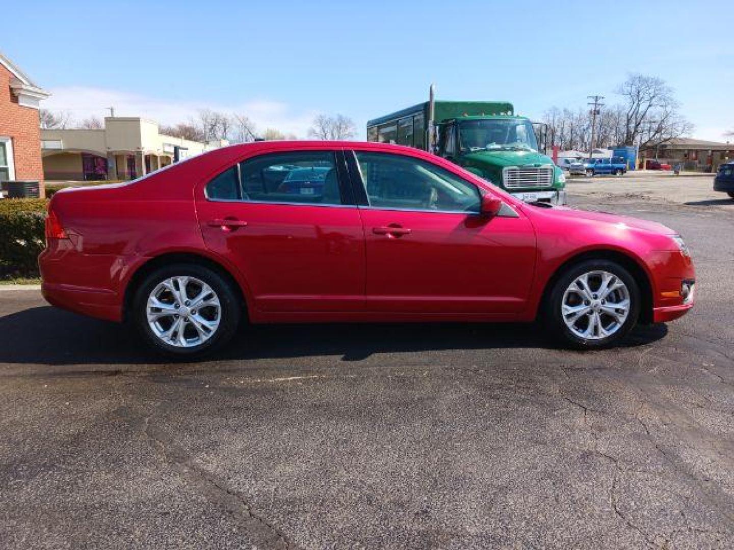 2012 Red Candy Metallic Ford Fusion SE (3FAHP0HA2CR) with an 2.5L L4 DOHC 16V engine, located at 1865 W 2nd St., Xenia, OH, 45385, (937) 372-7777, 39.681259, -83.961945 - Photo#4