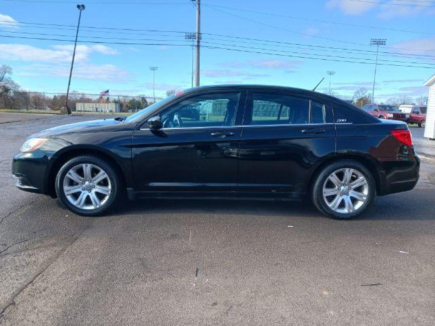 2012 Black Chrysler 200 Touring (1C3CCBBB4CN) with an 2.4L L4 DOHC 16V engine, 6-Speed Automatic transmission, located at 1865 W 2nd St., Xenia, OH, 45385, (937) 372-7777, 39.681259, -83.961945 - Photo#3