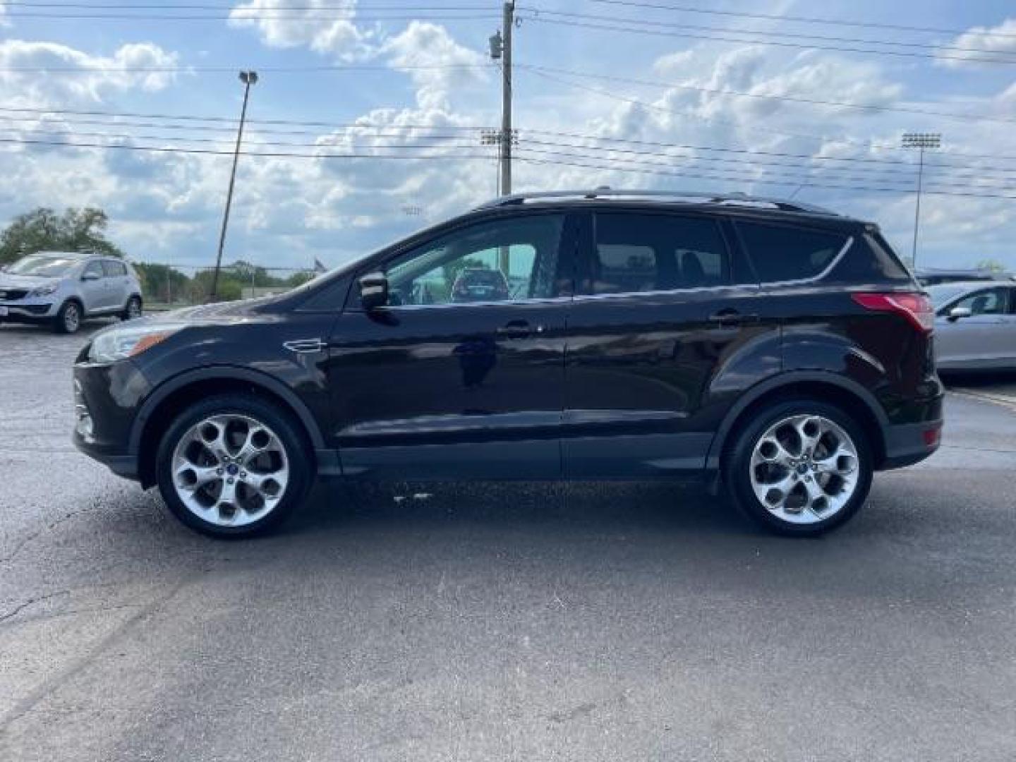 2013 Tuxedo Black Ford Escape Titanium FWD (1FMCU0J98DU) with an 2.0L L4 DOHC 16V engine, 6-Speed Automatic transmission, located at 1865 W 2nd St., Xenia, OH, 45385, (937) 372-7777, 39.681259, -83.961945 - Photo#2