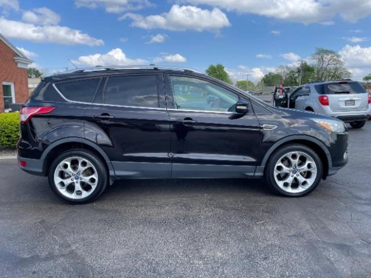 2013 Tuxedo Black Ford Escape Titanium FWD (1FMCU0J98DU) with an 2.0L L4 DOHC 16V engine, 6-Speed Automatic transmission, located at 1865 W 2nd St., Xenia, OH, 45385, (937) 372-7777, 39.681259, -83.961945 - Photo#3