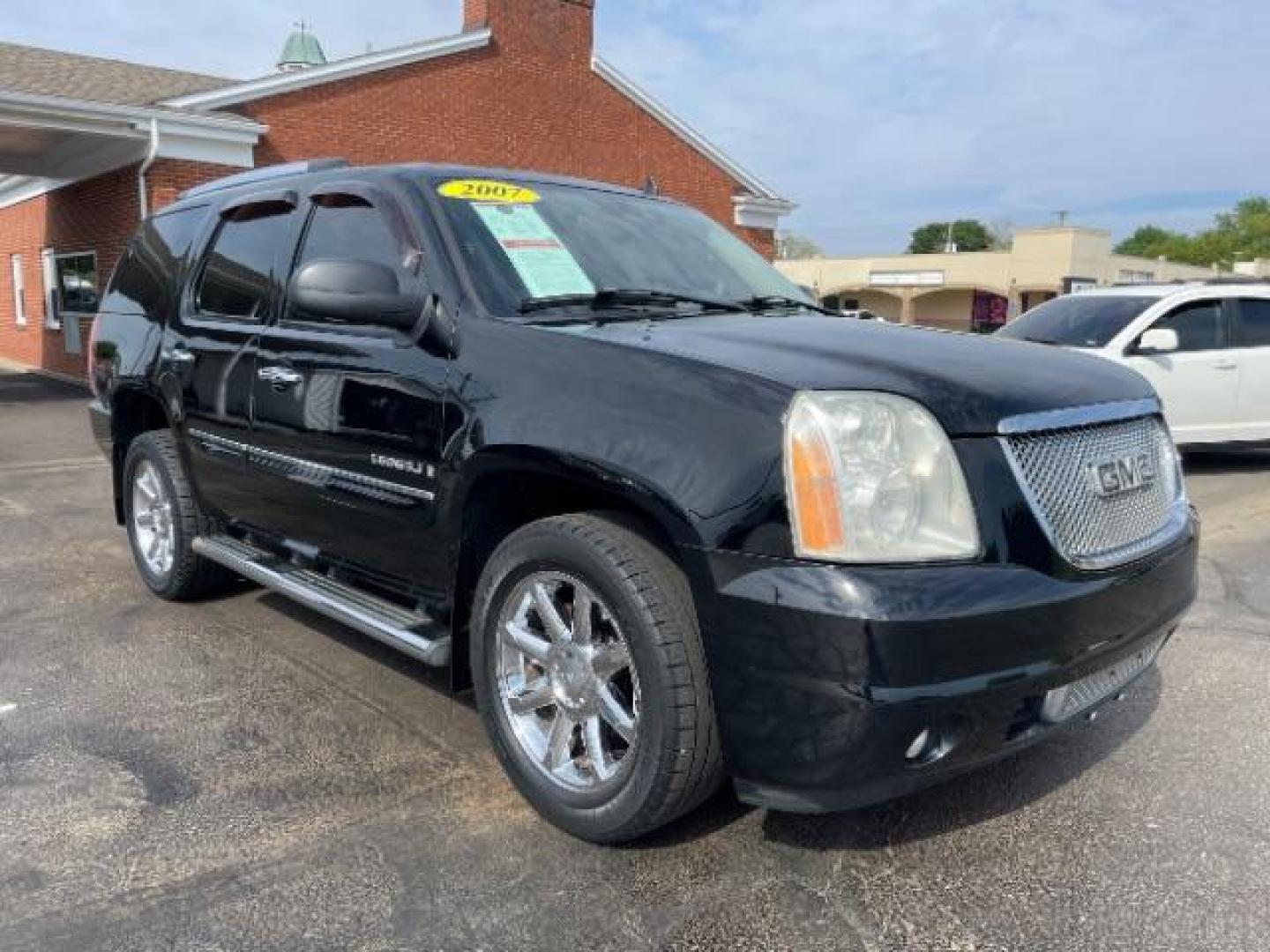 2007 Onyx Black GMC Yukon Denali AWD (1GKFK63807J) with an 6.2L V8 OHV 16V engine, 4-Speed Automatic transmission, located at 1865 W 2nd St., Xenia, OH, 45385, (937) 372-7777, 39.681259, -83.961945 - Photo#0