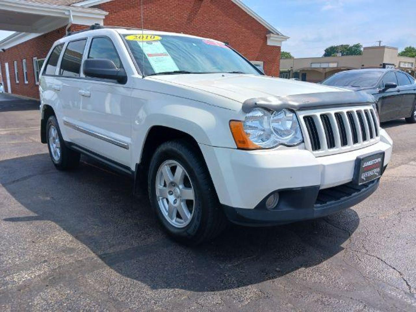 2010 Stone White Jeep Grand Cherokee Laredo 4WD (1J4PR4GK8AC) with an 3.7L V6 SOHC 12V engine, 5-Speed Automatic transmission, located at 1865 W 2nd St., Xenia, OH, 45385, (937) 372-7777, 39.681259, -83.961945 - Photo#0