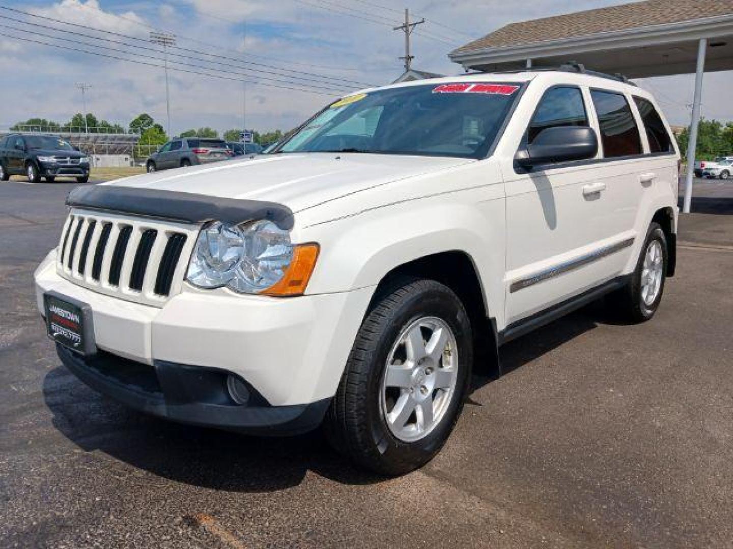 2010 Stone White Jeep Grand Cherokee Laredo 4WD (1J4PR4GK8AC) with an 3.7L V6 SOHC 12V engine, 5-Speed Automatic transmission, located at 1865 W 2nd St., Xenia, OH, 45385, (937) 372-7777, 39.681259, -83.961945 - Photo#1