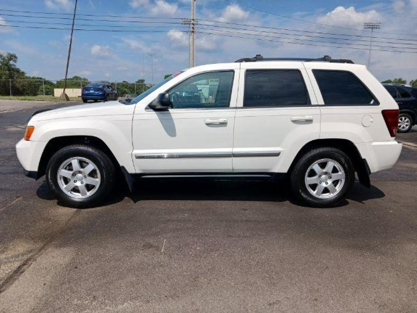 2010 Stone White Jeep Grand Cherokee Laredo 4WD (1J4PR4GK8AC) with an 3.7L V6 SOHC 12V engine, 5-Speed Automatic transmission, located at 1865 W 2nd St., Xenia, OH, 45385, (937) 372-7777, 39.681259, -83.961945 - Photo#2