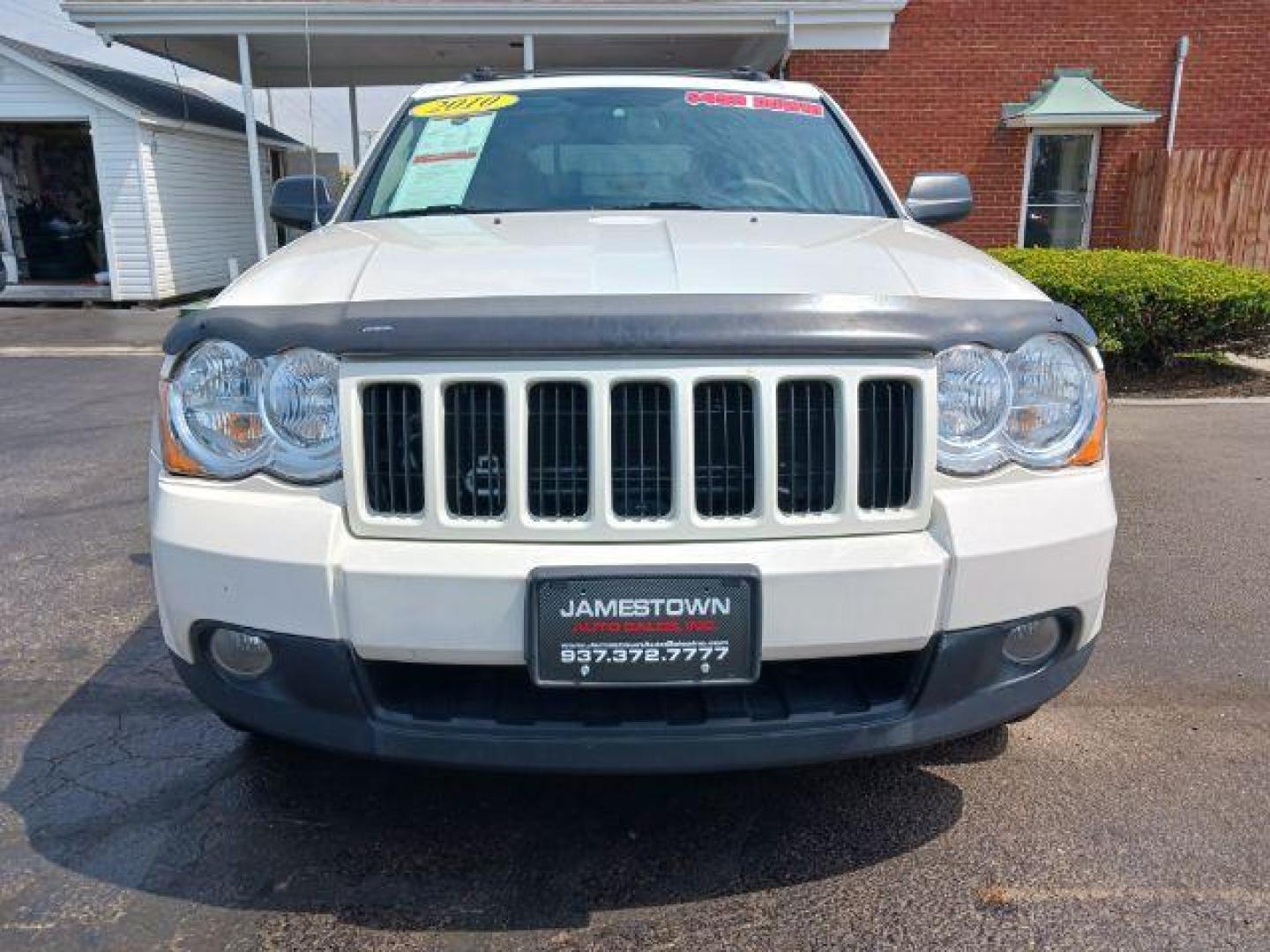 2010 Stone White Jeep Grand Cherokee Laredo 4WD (1J4PR4GK8AC) with an 3.7L V6 SOHC 12V engine, 5-Speed Automatic transmission, located at 1865 W 2nd St., Xenia, OH, 45385, (937) 372-7777, 39.681259, -83.961945 - Photo#4