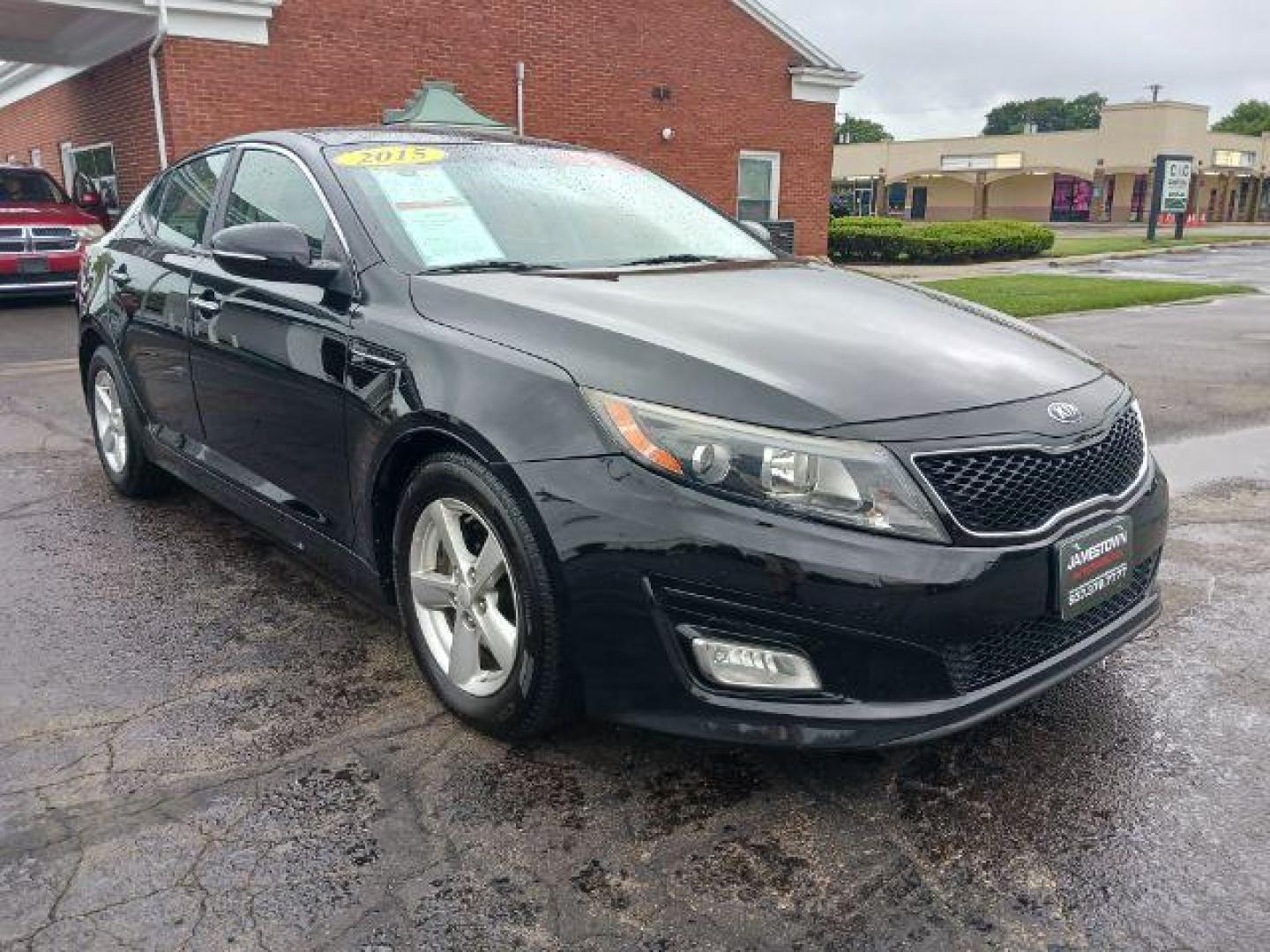 2015 Ebony Black Kia Optima LX (5XXGM4A77FG) with an 2.4L L4 DOHC 16V engine, 6-Speed Automatic transmission, located at 1865 W 2nd St., Xenia, OH, 45385, (937) 372-7777, 39.681259, -83.961945 - Photo#0