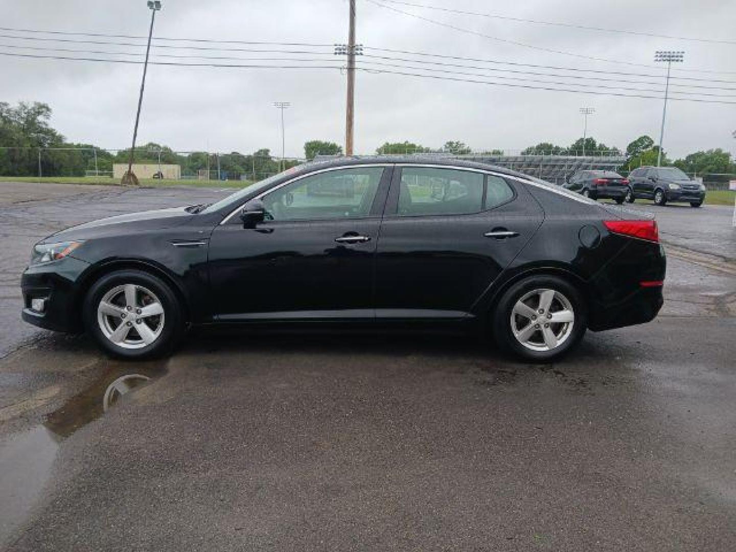 2015 Ebony Black Kia Optima LX (5XXGM4A77FG) with an 2.4L L4 DOHC 16V engine, 6-Speed Automatic transmission, located at 1865 W 2nd St., Xenia, OH, 45385, (937) 372-7777, 39.681259, -83.961945 - Photo#2