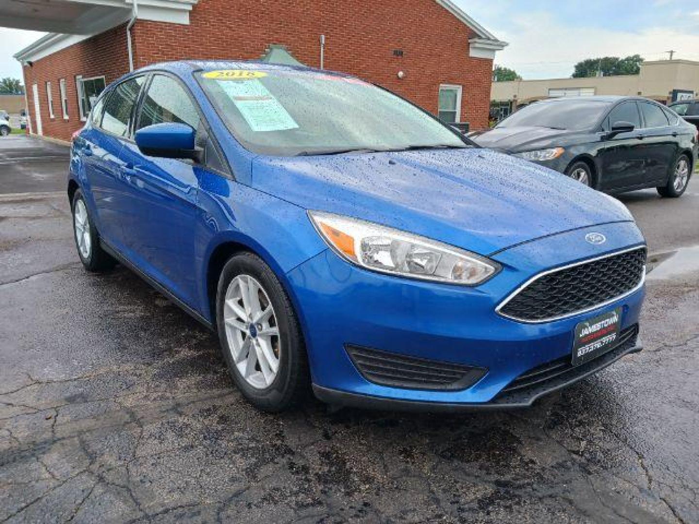 2018 Lightning Blue Metallic Ford Focus SE Hatch (1FADP3K29JL) with an 2.0L L4 DOHC 16V engine, located at 1865 W 2nd St., Xenia, OH, 45385, (937) 372-7777, 39.681259, -83.961945 - Photo#0