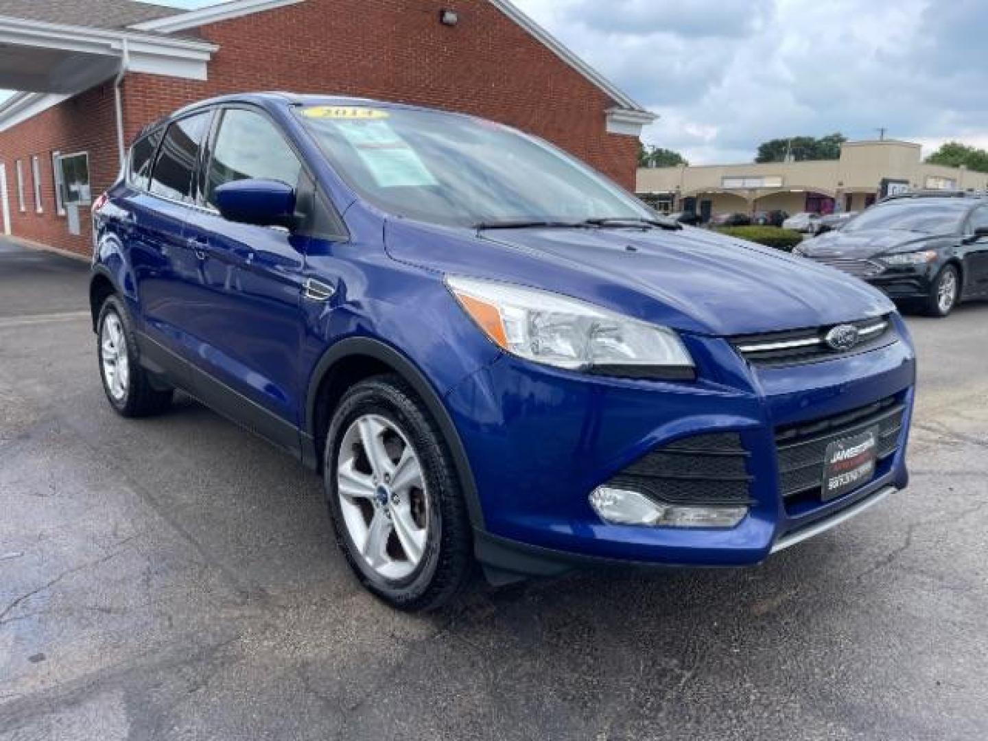 2014 Deep Impact Blue Ford Escape SE 4WD (1FMCU9G96EU) with an 2.0L L4 DOHC 16V engine, 6-Speed Automatic transmission, located at 1865 W 2nd St., Xenia, OH, 45385, (937) 372-7777, 39.681259, -83.961945 - Photo#0