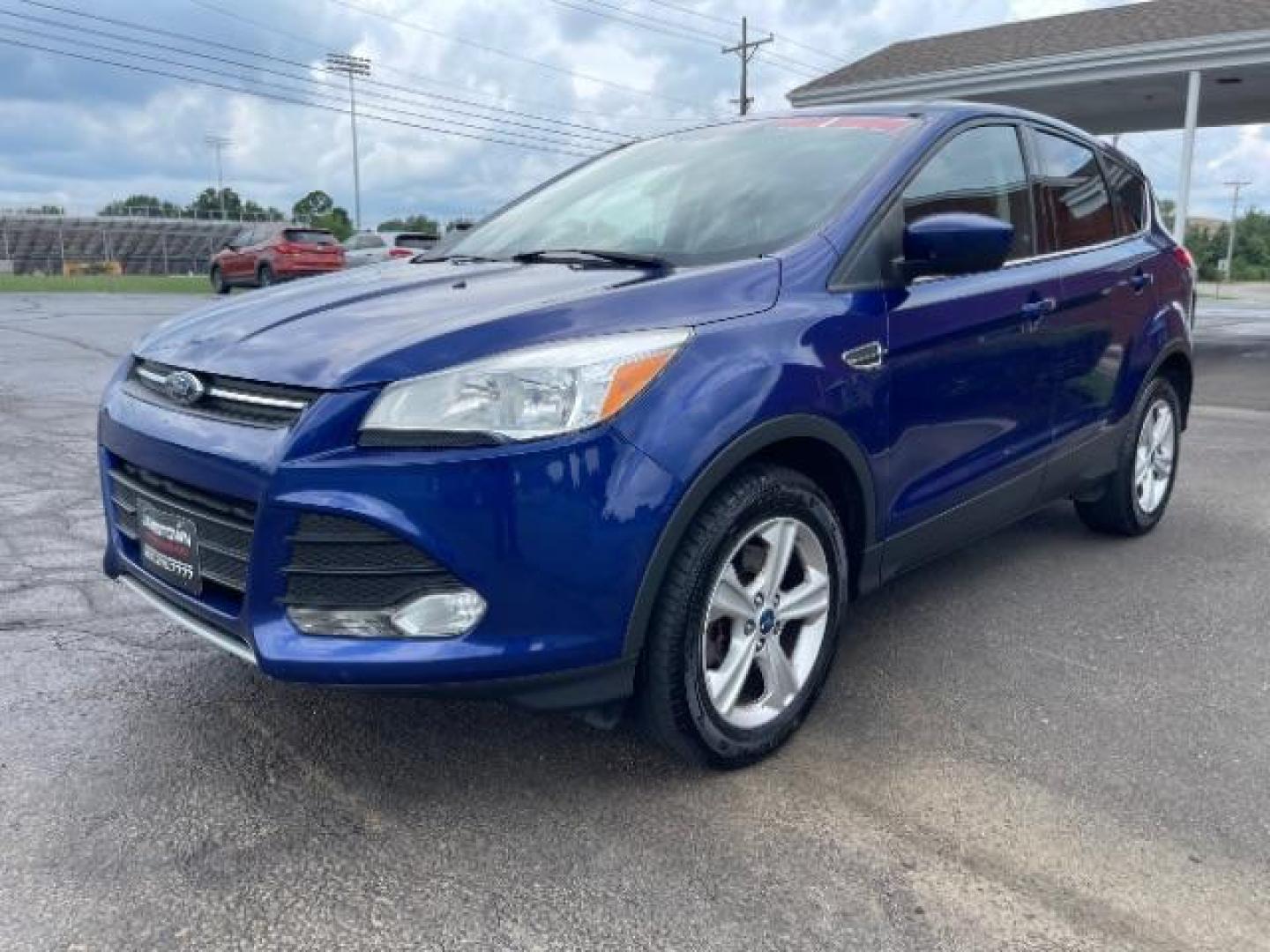 2014 Deep Impact Blue Ford Escape SE 4WD (1FMCU9G96EU) with an 2.0L L4 DOHC 16V engine, 6-Speed Automatic transmission, located at 1865 W 2nd St., Xenia, OH, 45385, (937) 372-7777, 39.681259, -83.961945 - Photo#1