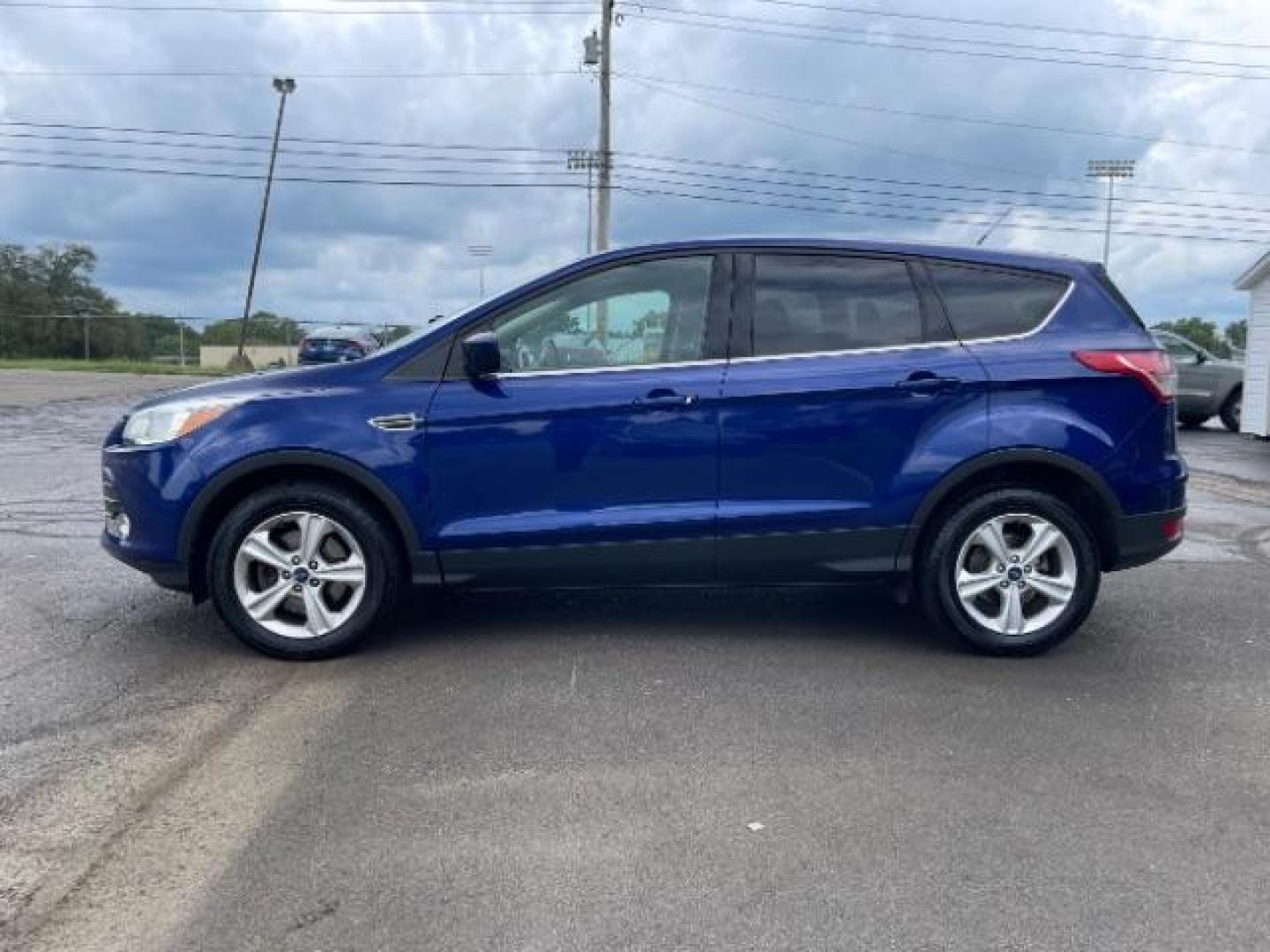 2014 Deep Impact Blue Ford Escape SE 4WD (1FMCU9G96EU) with an 2.0L L4 DOHC 16V engine, 6-Speed Automatic transmission, located at 1865 W 2nd St., Xenia, OH, 45385, (937) 372-7777, 39.681259, -83.961945 - Photo#2