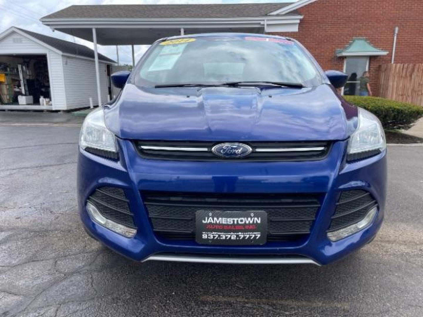 2014 Deep Impact Blue Ford Escape SE 4WD (1FMCU9G96EU) with an 2.0L L4 DOHC 16V engine, 6-Speed Automatic transmission, located at 1865 W 2nd St., Xenia, OH, 45385, (937) 372-7777, 39.681259, -83.961945 - Photo#4