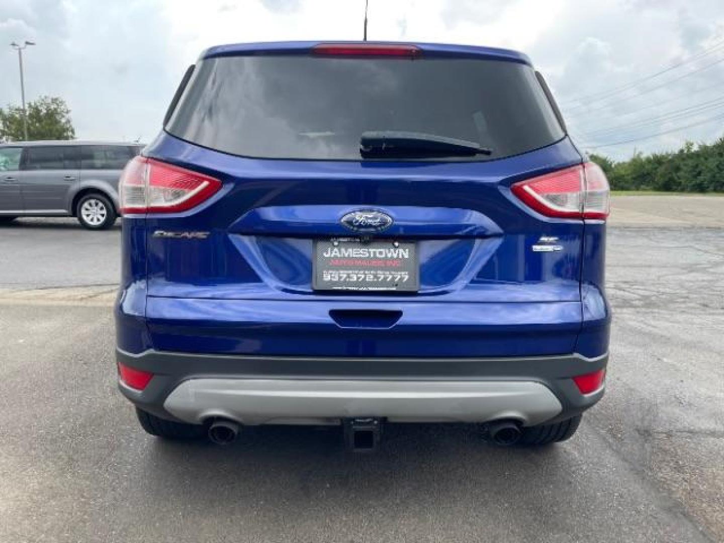 2014 Deep Impact Blue Ford Escape SE 4WD (1FMCU9G96EU) with an 2.0L L4 DOHC 16V engine, 6-Speed Automatic transmission, located at 1865 W 2nd St., Xenia, OH, 45385, (937) 372-7777, 39.681259, -83.961945 - Photo#5