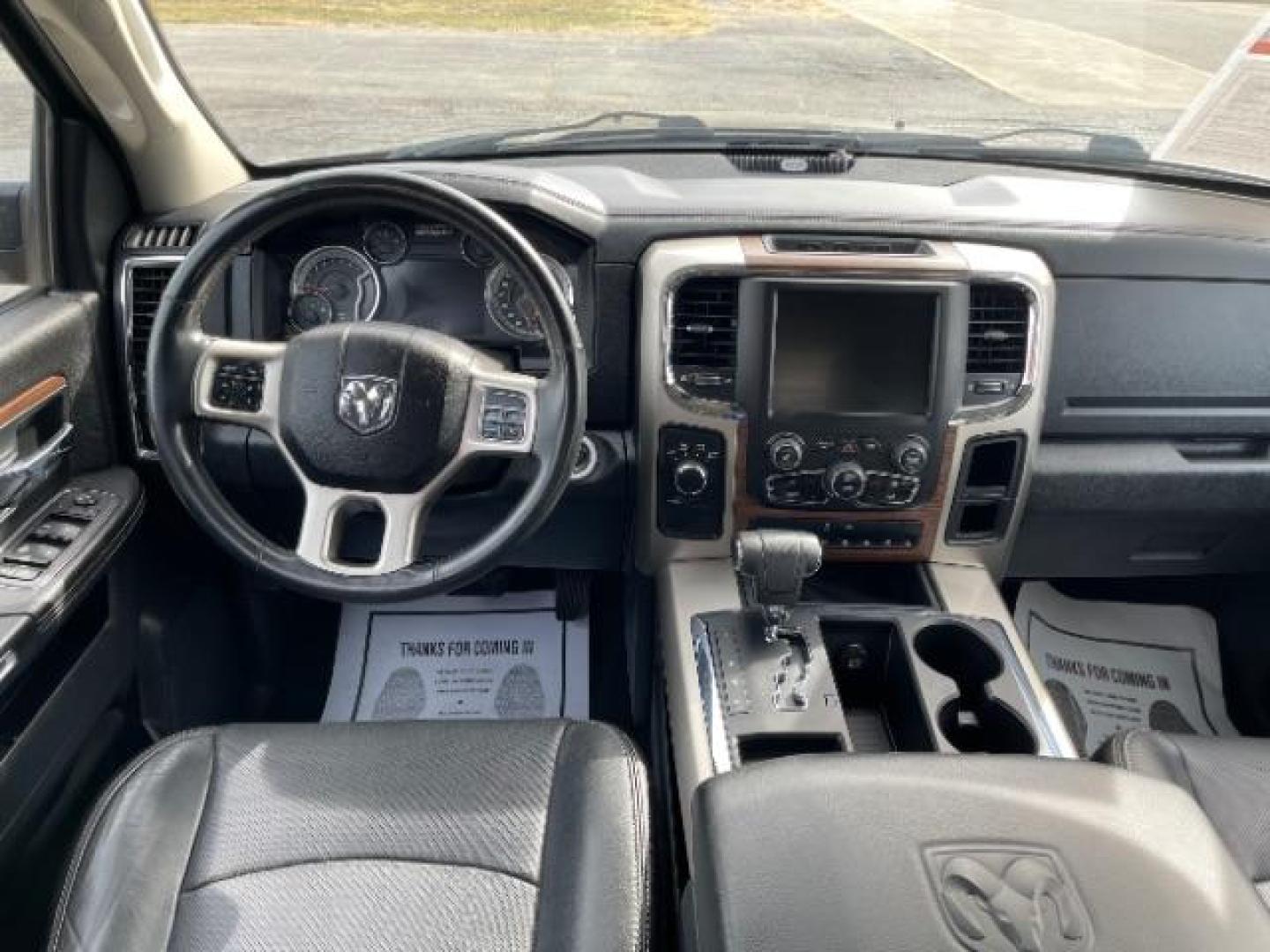 2013 Black RAM 1500 Laramie Quad Cab 4WD (1C6RR7JT5DS) with an 5.7L V8 OHV 16V engine, 6-Speed Automatic transmission, located at 1865 W 2nd St., Xenia, OH, 45385, (937) 372-7777, 39.681259, -83.961945 - Photo#9