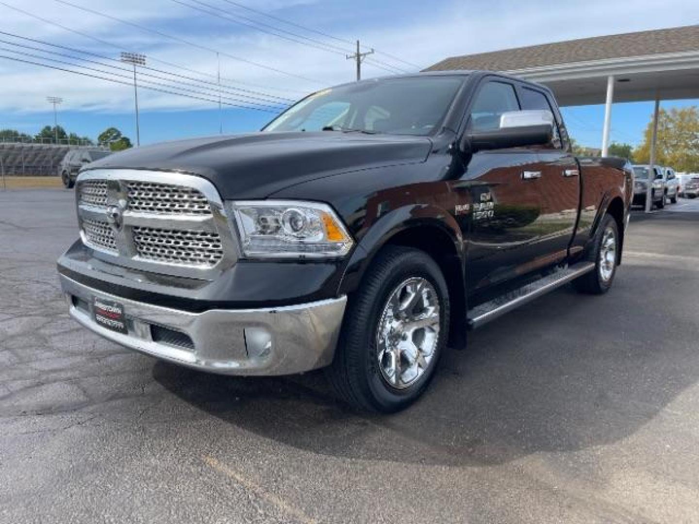 2013 Black RAM 1500 Laramie Quad Cab 4WD (1C6RR7JT5DS) with an 5.7L V8 OHV 16V engine, 6-Speed Automatic transmission, located at 1865 W 2nd St., Xenia, OH, 45385, (937) 372-7777, 39.681259, -83.961945 - Photo#1