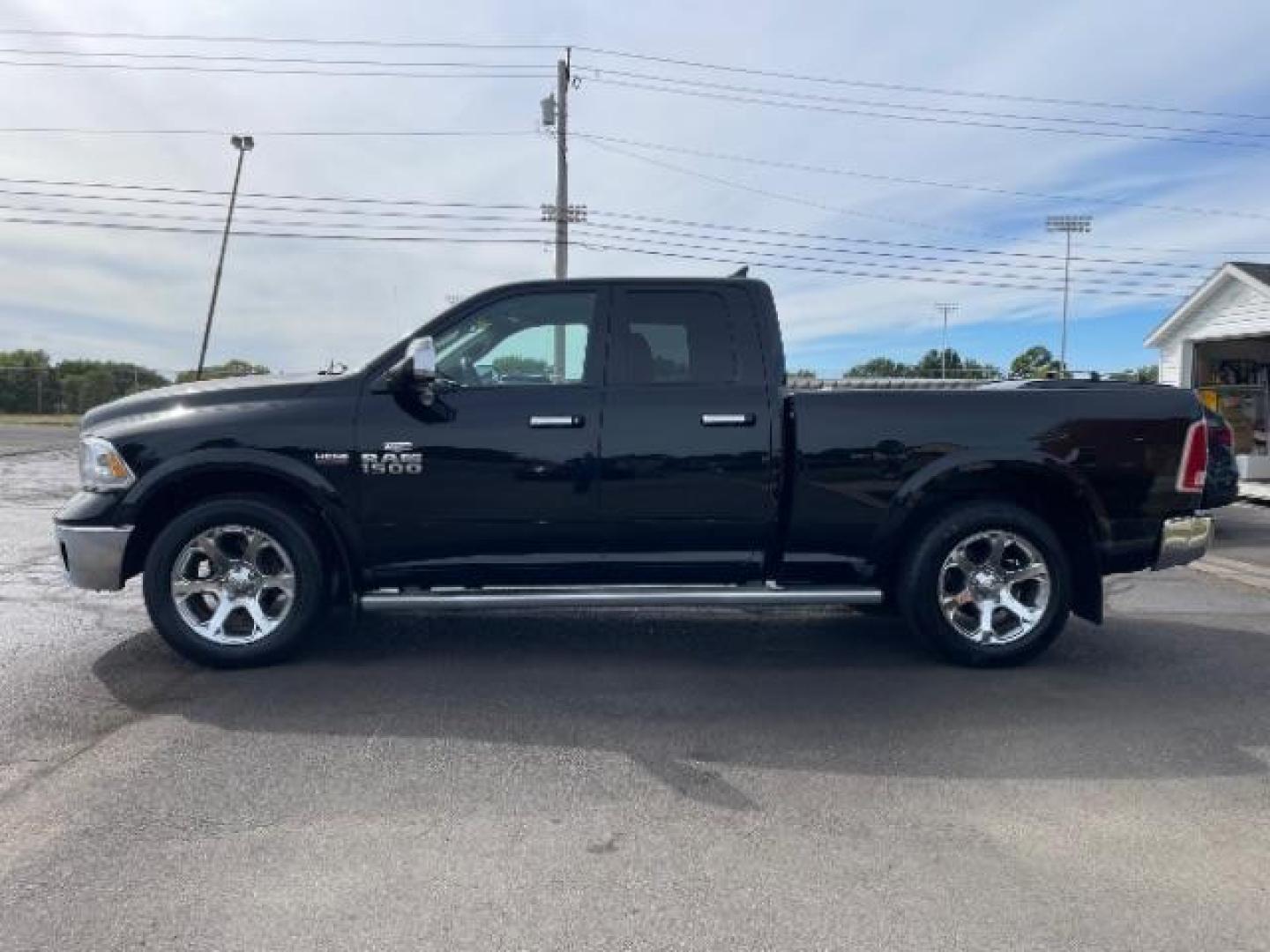 2013 Black RAM 1500 Laramie Quad Cab 4WD (1C6RR7JT5DS) with an 5.7L V8 OHV 16V engine, 6-Speed Automatic transmission, located at 1865 W 2nd St., Xenia, OH, 45385, (937) 372-7777, 39.681259, -83.961945 - Photo#4