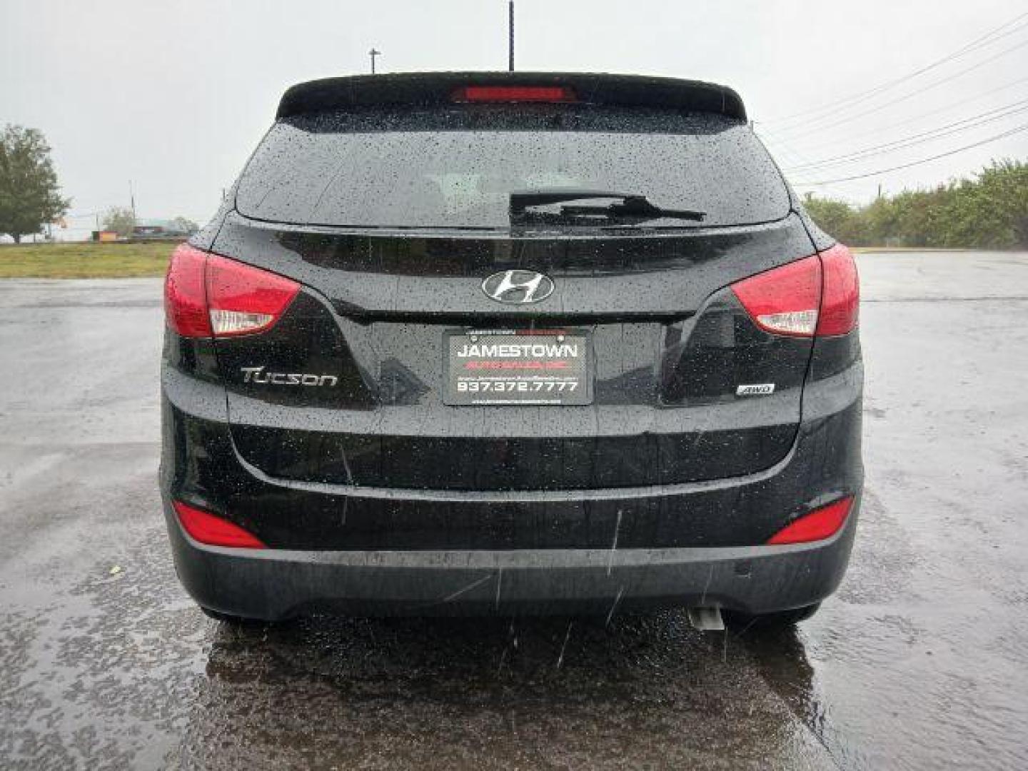 2014 Black Hyundai Tucson GL Auto AWD (KM8JTCAF0EU) with an 2.0L L4 DOHC 16V engine, 6-Speed Automatic transmission, located at 1865 W 2nd St., Xenia, OH, 45385, (937) 372-7777, 39.681259, -83.961945 - Photo#5